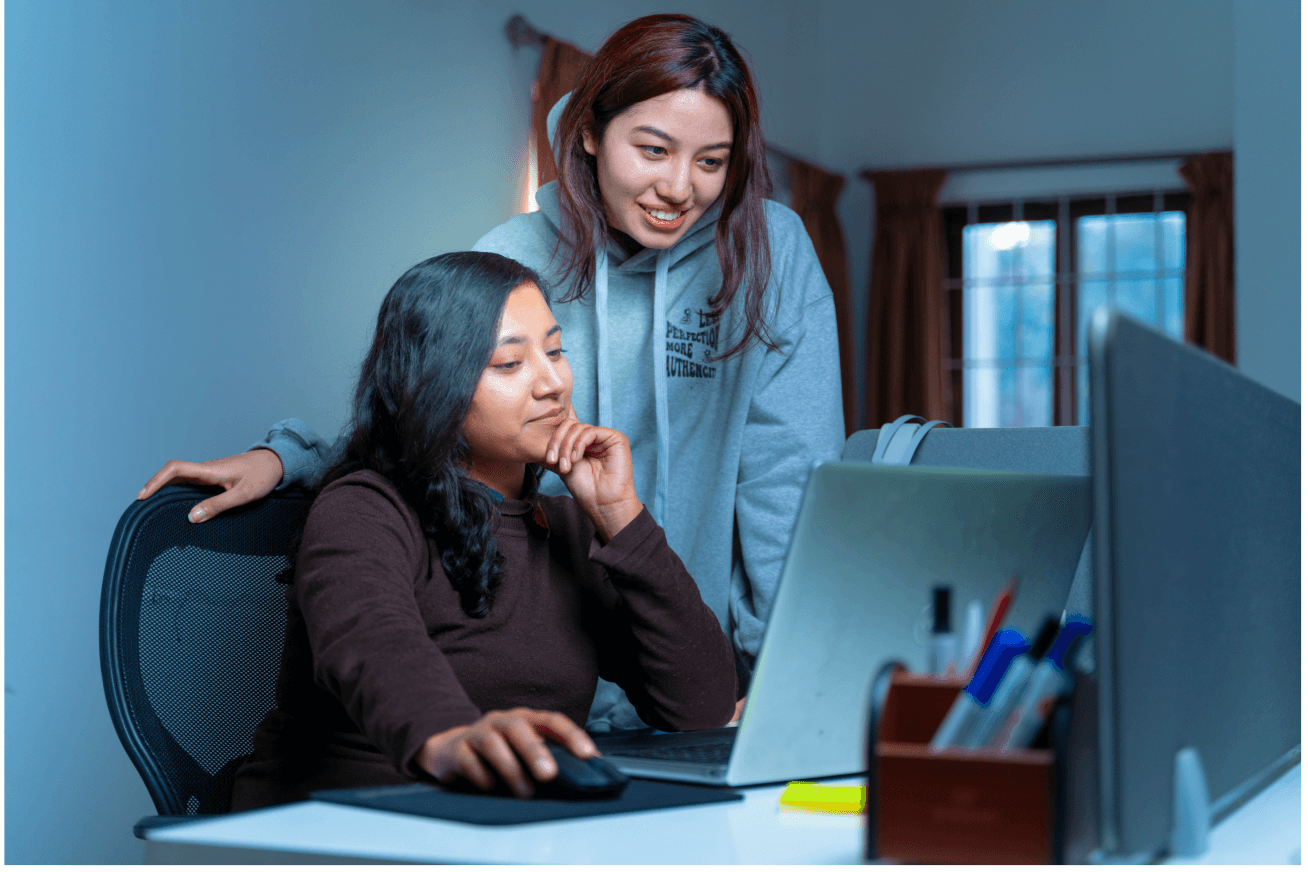 Two people looking at laptop